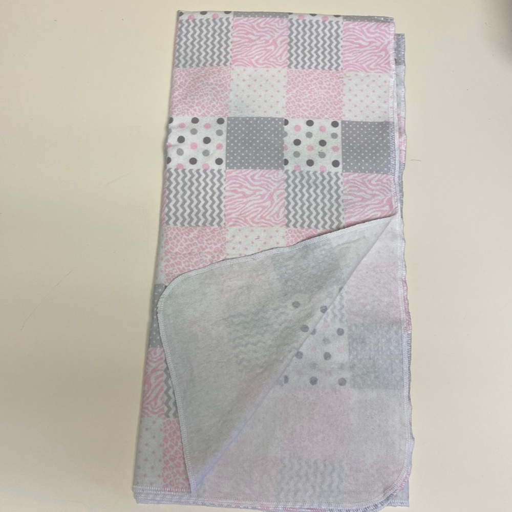 Swaddling flannel receiving blanket and burp cloth.